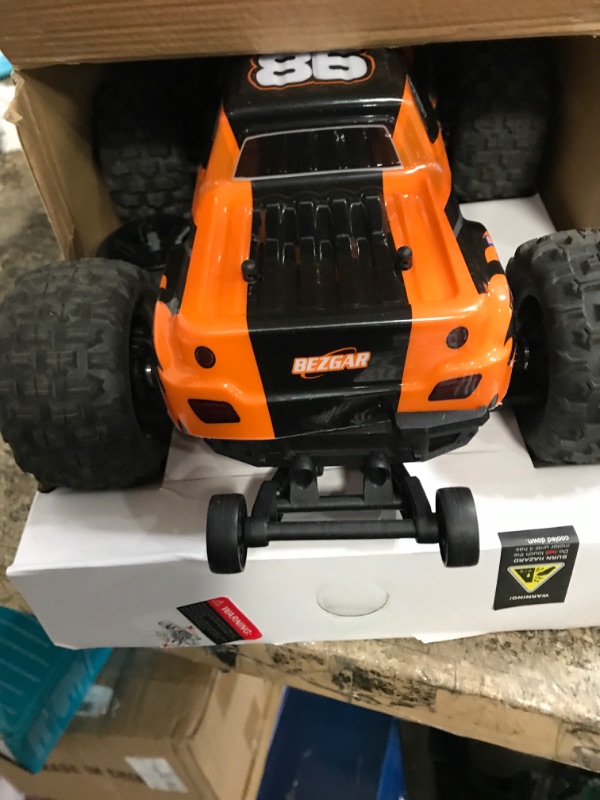 Photo 2 of BEZGAR 1:16 Scale High Speed RC Cars | HP161 4X4 Off-Road Electric RC Trucks, Waterproof Hobby Grade Remote Control Cars - All Terrain Toy Truck with Upgrade Chassis Two Batteries for Kid Adults Orange