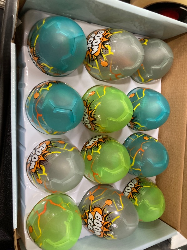 Photo 2 of TEMI Easter Basket Stuffers 12 Pack Luminous Jumbo Dinosaur Eggs for Kids, Dino Eggs Filled with Realistic Dinosaurs Figures & Trees, Easter Gift for 3 4 5 6 7 Years Boys Girls