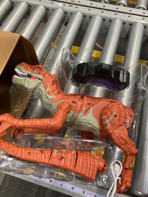 Photo 2 of TEMI Remote Control Dinosaur Toy for Kids, Rc Simulated T-Rex Dinosaur Toy with Water Mist Spray, Light and Sounds, Real Electric Walking Dinosaur Robot for Boys Girls 3 4 5 6 7 Years remote brown 1 pack