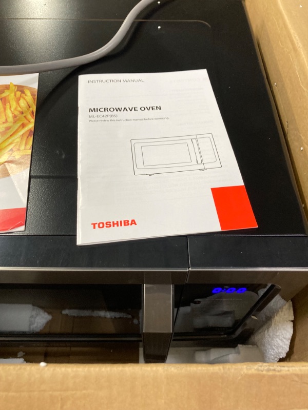 Photo 2 of ***DAMAGE TO THE TOP OF THE MICROWAVE*** TOSHIBA 4-in-1 ML-EC42P(BS) Countertop Microwave Oven, Smart Sensor, Convection, Air Fryer Combo, Mute Function, Position Memory 13.6" Turntable, 1.5 Cu Ft, 1000W, Black 1.5 Airfryer Black