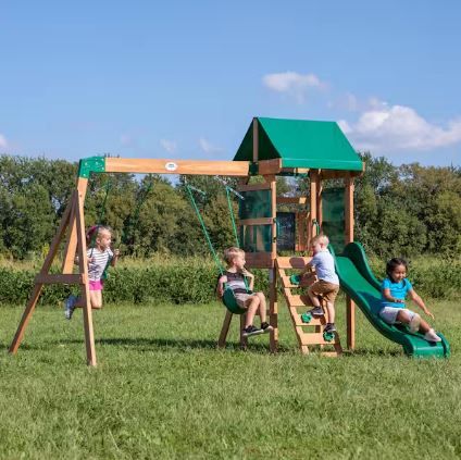 Photo 1 of Buckley Hill All Cedar Wood Children's Swing Set Playset with Elevated Clubhouse, Rockwall ladder, Swings and Wave Slide
