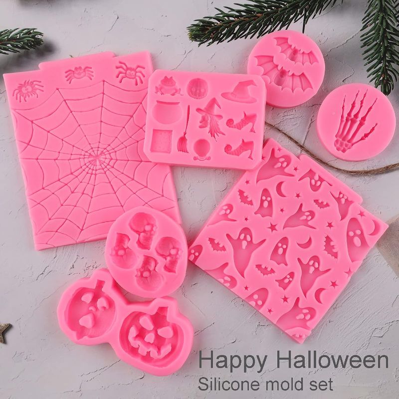 Photo 1 of Halloween Silicone Mold 7 Pack Pumpkin Silicone Cake Mold Cupcake Chocolate Mold Skull Batskeleton Hand Bat Ghost Witch Candy Mold for Halloween Party