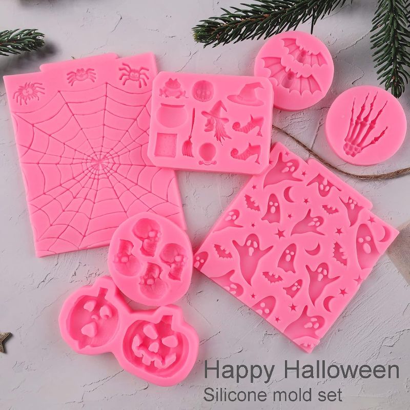 Photo 1 of Halloween Silicone Mold 7 Pack Pumpkin Silicone Cake Mold Cupcake Chocolate Mold Skull Batskeleton Hand Bat Ghost Witch Candy Mold for Halloween Party
