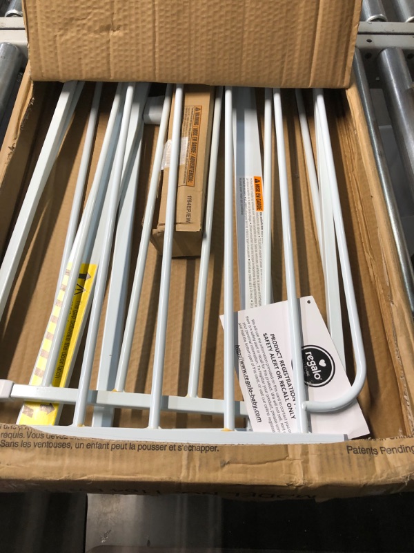 Photo 2 of Regalo Easy Step 38.5-Inch Wide Walk Thru Baby Gate, Includes 6-Inch Extension Kit, Pressure Mount Kit, Wall Cups

