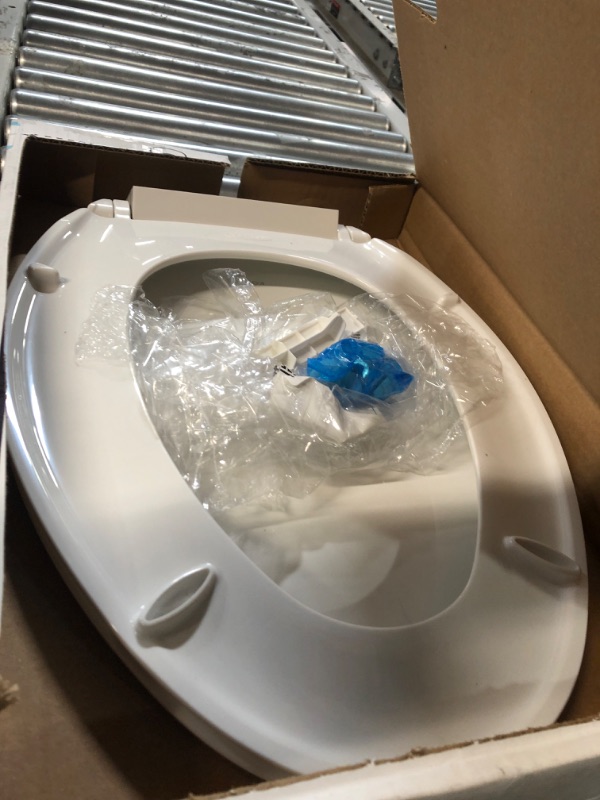 Photo 2 of ***USED - LIKELY MISSING PARTS - UNABLE TO VERIFY FUNCTIONALITY***
KOHLER 20110-0 Brevia Elongated Toilet Seat with Grip-Tight Bumpers, Quiet Close, Attach Hardware, Quick-Release Hinges