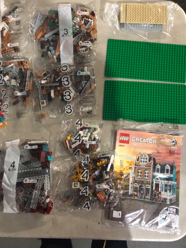 Photo 5 of ***USED*DAMAGE TO BOX*UNKNOWN IF MISSING PIECES*BAGS APPEAR TO BE SEALED***
LEGO Creator Expert Bookshop 10270 Modular Building Kit, Big Set and Collectors Toy for Adults (2,504 Pieces) Standard Packaging