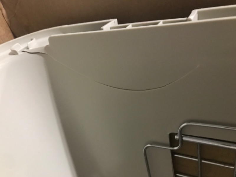 Photo 3 of ***MINOR DAMAGE**SIDE OF LID IS CRACKED*PICTURED***
SportPet Designs Plastic Kennels Rolling Plastic Wire Door Travel Dog Crate - Medium, Gray (CM-2001-CS01)