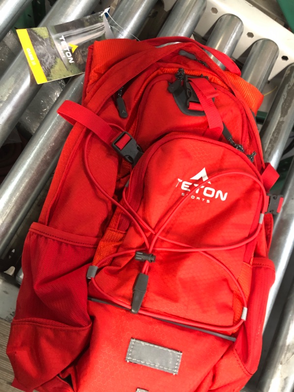 Photo 1 of TETON Sports Oasis Hydration Backpacks– Hydration Backpack for Hiking, Running, Cycling, Biking, 2L Hydration Bladder Included – Plus a Sewn-in Rain Cover 2L Bladder - 2022 Model Stark Red