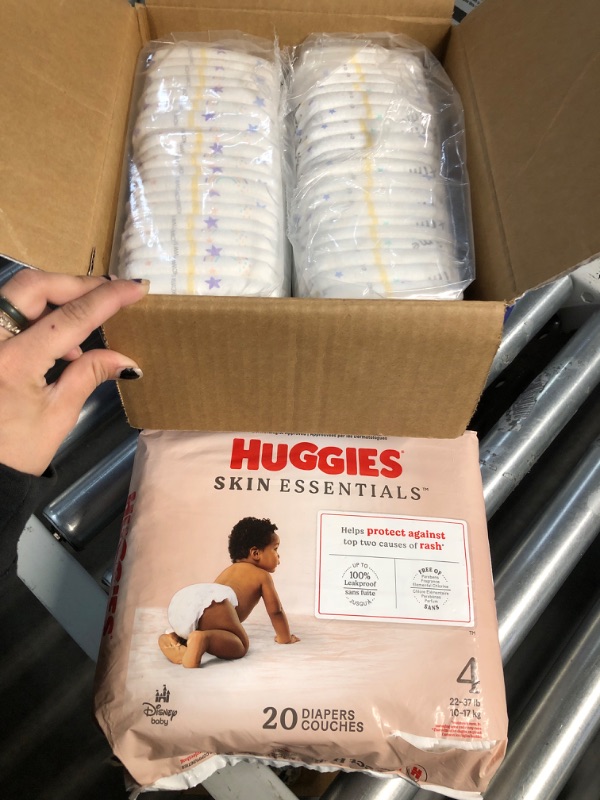 Photo 1 of DIAPER BUNDLE* NONREFUNDABLE* Huggies Size 4 Diapers, Skin Essentials Baby Diapers, Size 4 (22-37 lbs), 20 Count & Huggies Size 5 Diapers, Little Snugglers Baby Diapers, Size 5, 44 Count
