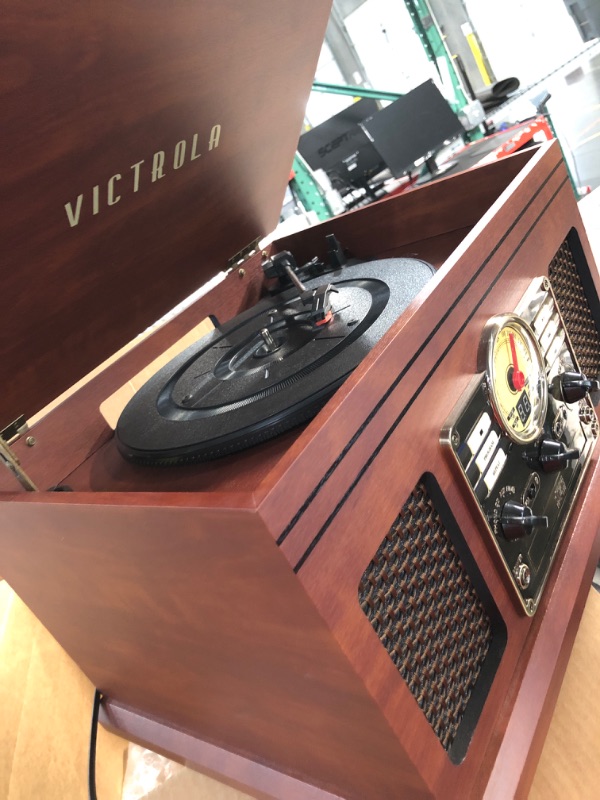 Photo 2 of SEE NOTES**
Victrola Nostalgic 6-in-1 Bluetooth Record Player & Multimedia Center with Built-in Speakers - 3-Speed Turntable, CD & Cassette Player, FM Radio | Wireless Music Streaming | Mahogany Mahogany Entertainment Center