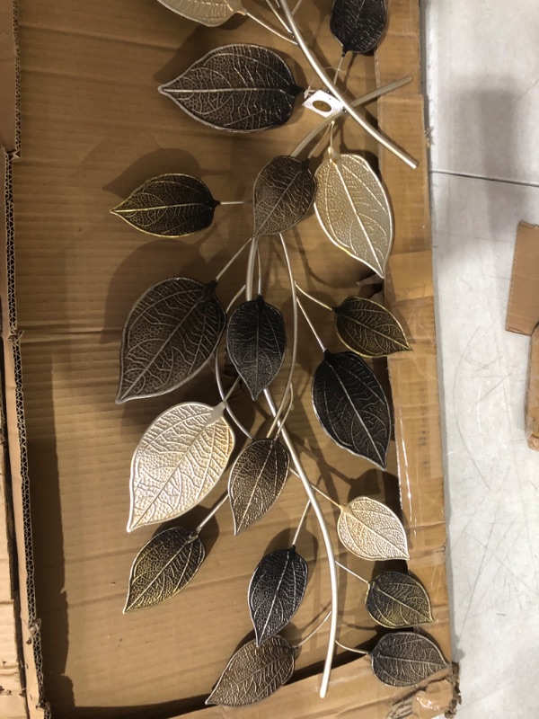 Photo 4 of ***USED*ONE LEAF HAS BROKEN OFF*PICTURED***
Deco 79 Metal Leaf Long Textured Wall Decor with Multiple Shades, 50" x 2" x 15", Bronze