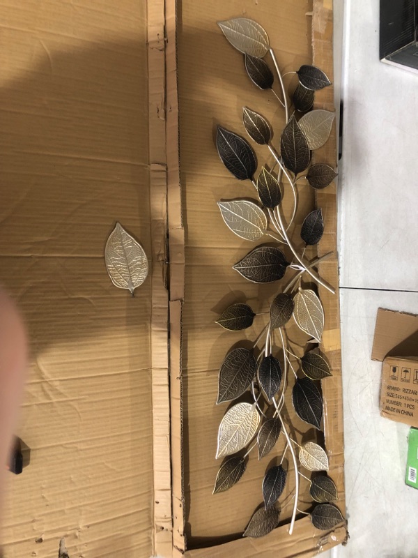 Photo 5 of ***USED*ONE LEAF HAS BROKEN OFF*PICTURED***
Deco 79 Metal Leaf Long Textured Wall Decor with Multiple Shades, 50" x 2" x 15", Bronze