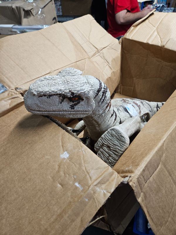 Photo 1 of **MAJOR DAMAGE - AS-IS**
Jurassic World Toys Super Colossal Atrociraptor Action Figure, 3-Ft Long Dinosaur Toy with Eating Feature
