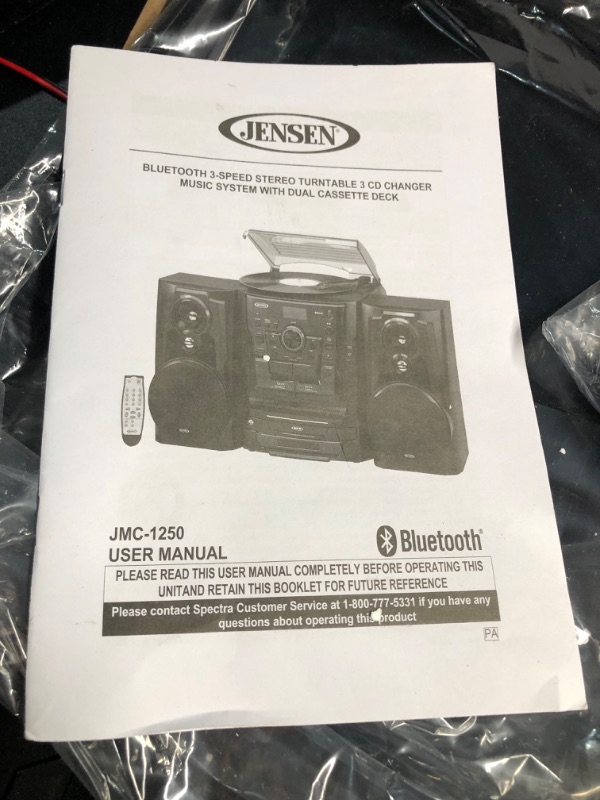 Photo 2 of Jensen® Bluetooth® 3 Speed Stereo Turntable 3 CD Changer Music System with Dual Cassette Deck, Pitch Control and Remote Control