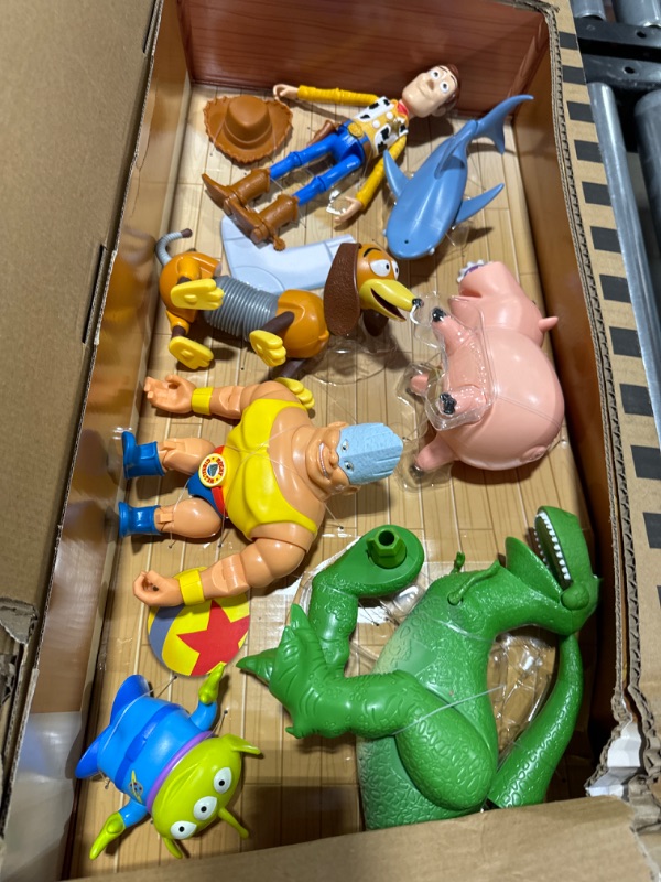 Photo 2 of Disney and Pixar Toy Story Set of 7 Action Figures with Woody, Slinky, Rex, Hamm, Alien, Rocky & Shark, Disney100 Collectible [Amazon Exclusive]