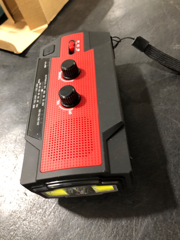 Photo 1 of ?2021 Newest?RunningSnail Emergency Crank Radio?4000mAh-Solar Hand Crank Portable AM/FM/NOAA Weather Radio with 1W Flashlight and Motion Sensor Reading Lamp?Cell Phone Charger RED
