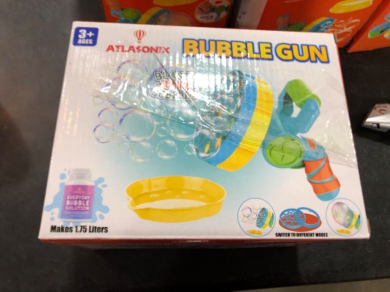 Photo 2 of Atlasonix Bubble Gun with Bubble Solution (60 oz), Bubble Blower for Kids - Bubble Guns for Toddlers, Bubble Toys, Bubble Blaster, Bubble Blaster, Bubble Blower for Toddlers