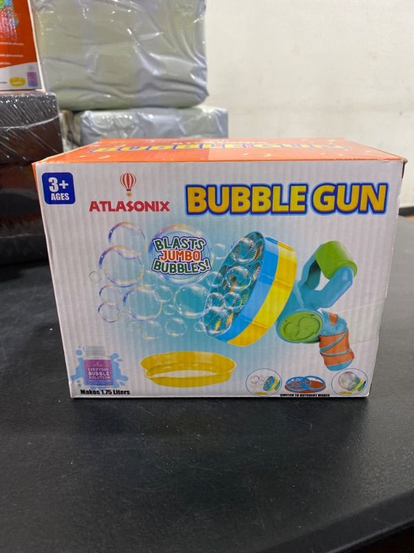 Photo 2 of Atlasonix Bubble Gun with Bubble Solution (60 oz), Bubble Blower for Kids - Bubble Guns for Toddlers, Bubble Toys, Bubble Blaster, Bubble Blaster, Bubble Blower for Toddlers