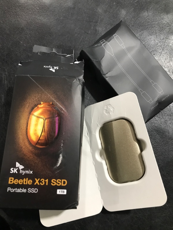 Photo 2 of SK hynix Beetle X31 1TB Portable SSD with DRAM, up to 1050MB/s, USB 3.2 Gen2, External Solid State Drive Compatible with Windowsbased PCs, Macs, Tablets, and Androidbased Smartphones, Game Consoles