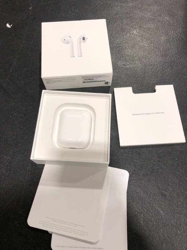 Photo 2 of Apple AirPods (2nd Generation) Wireless Ear Buds, Bluetooth Headphones with Lightning Charging Case Included, Over 24 Hours of Battery Life, Effortless Setup for iPhone--
