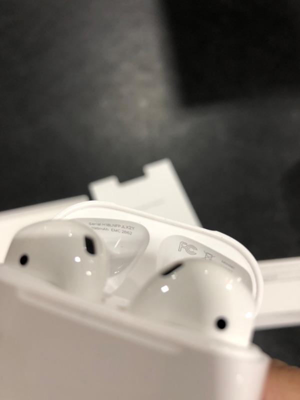Photo 1 of Apple AirPods (2nd Generation) Wireless Ear Buds, Bluetooth Headphones with Lightning Charging Case Included, Over 24 Hours of Battery Life, Effortless Setup for iPhone--

