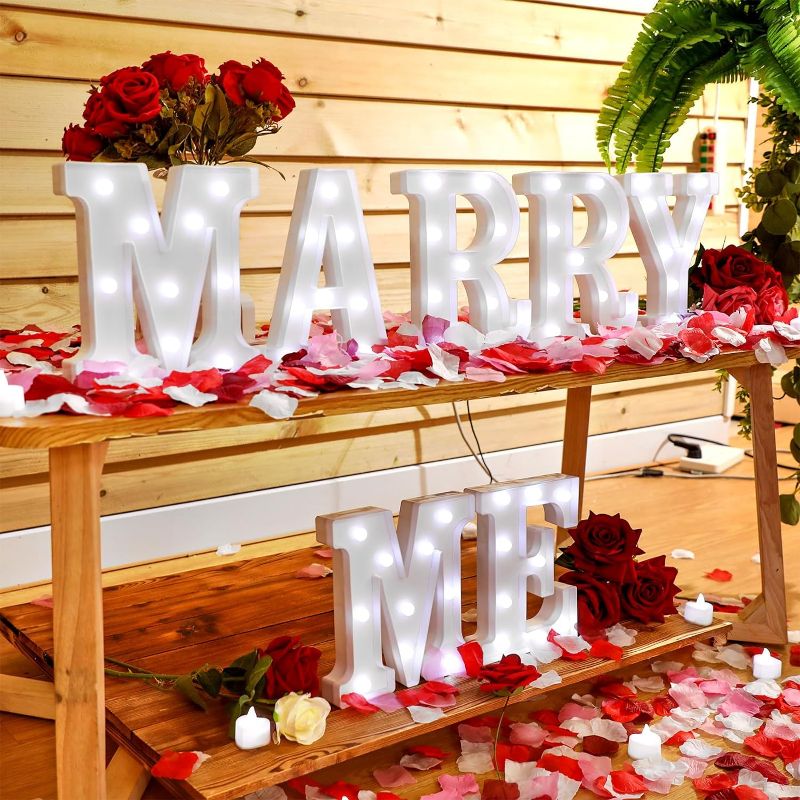 Photo 1 of Marry Me Letters Light Proposal Decorations Set Includes 7 LED Marry Me Sign Marry Me Letters Romantic Night Light and 1000 Rose Petals for Proposal Engagement Wedding Decor(White Light, Multicolor)
