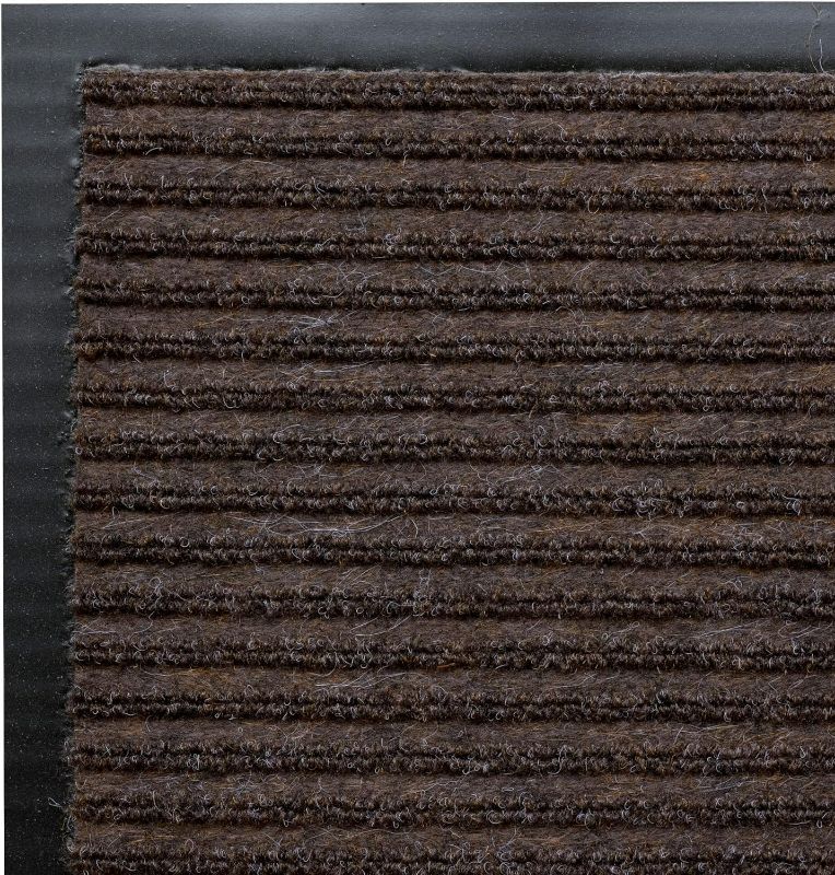 Photo 1 of **READ NOTES BELOW***FLOOR MAT 64 X 46 HEAVY DUTY RUBBER BOTTOM WITH SKID PROOF FABRIC INDOOR/OUTDOOR BLACK