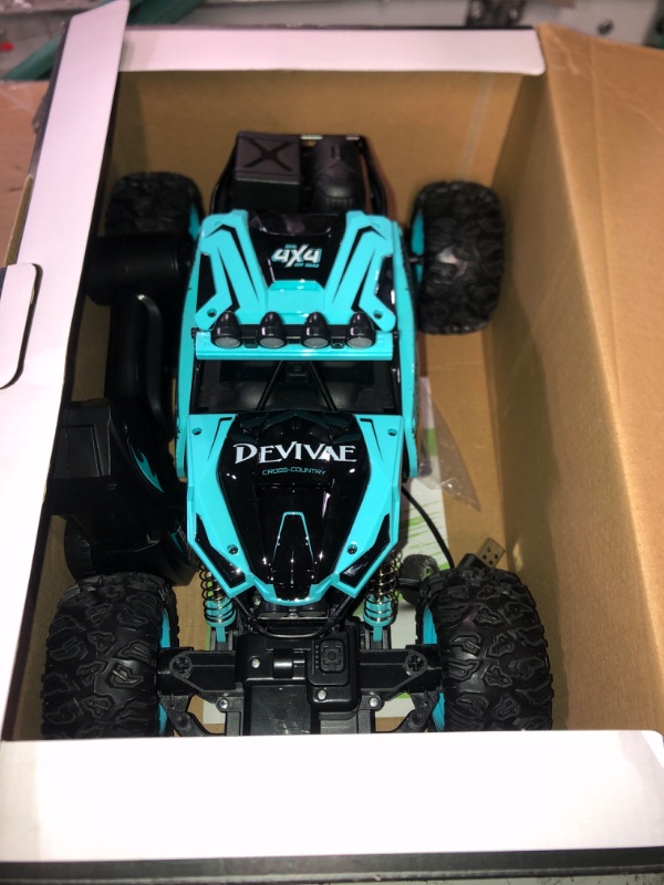 Photo 2 of CROBOLL 1:12 Large Remote Control Car for Boys Kids with Lifting Function,4WD RC Cars Electric Monster Truck Toy Gifts 4X4 Off-Road RC Rock Crawler 2.4GHz All Terrain RC Truck with 2 Batteries(Cyan)