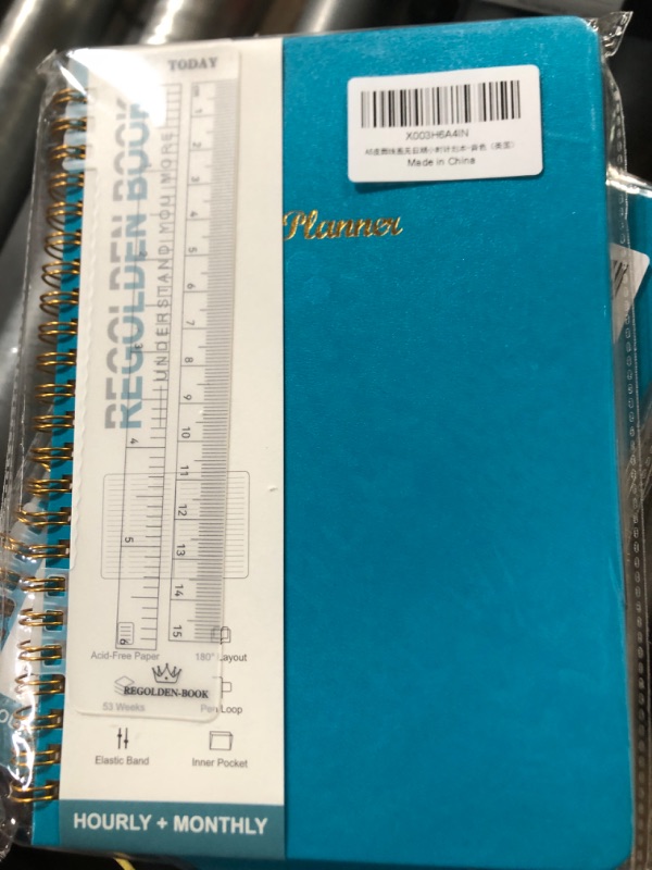 Photo 1 of Bluish teal notebook 