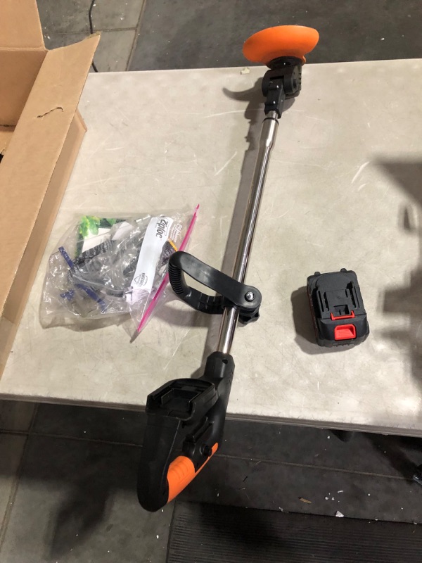 Photo 2 of ***USED - BLADE DAMAGED - SEE PICTURES***
Weed Trimmer, Orange, Battery Powered