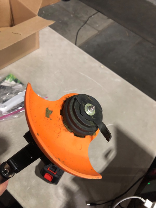 Photo 3 of ***USED - BLADE DAMAGED - SEE PICTURES***
Weed Trimmer, Orange, Battery Powered