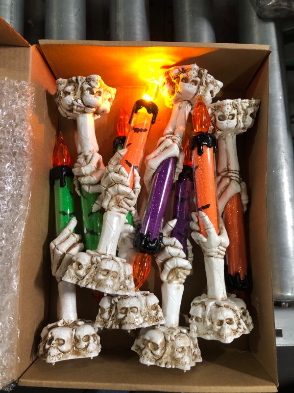 Photo 2 of 8 Pack Skeleton Hands Hold Lighted Candle Flameless Skeleton Ghost Hand Halloween Candles Light Up LED Skull Candle Skeleton Lamp Decorative Candle Holder Light for Indoor Outdoor Home Decorations