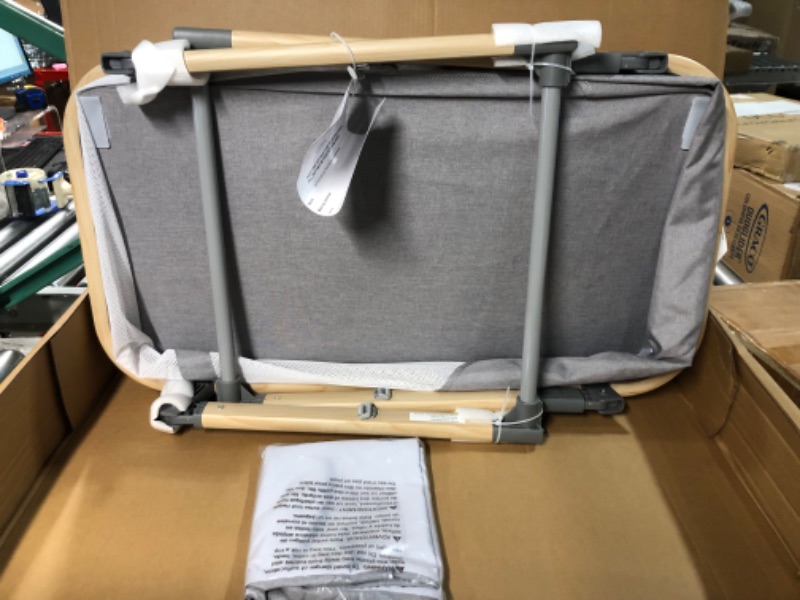 Photo 2 of Boppy Bassinet with Wipeable Mattress Pad and Two Mattress Covers Included, Featuring Anti-tilt Anchors and Mesh Sides, Lightweight and Stores Flat, No Assembly Required, Gray Pickup Sticks