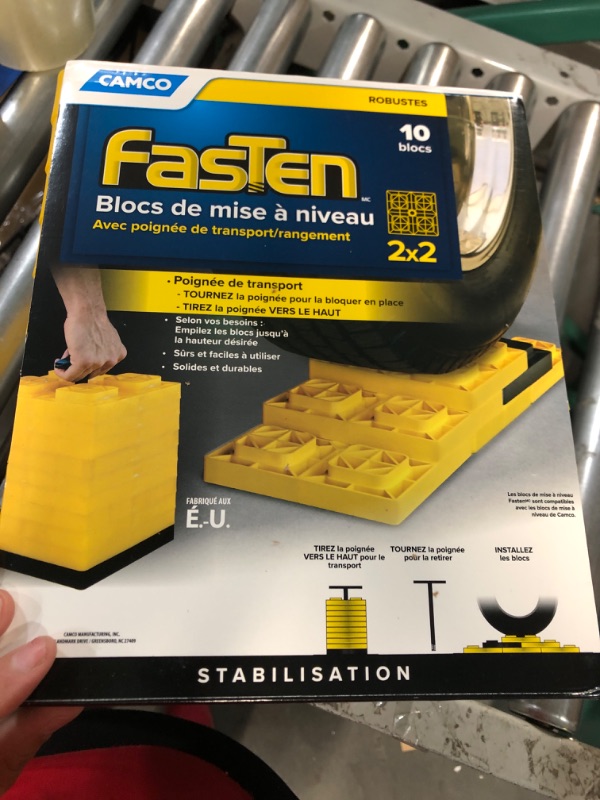 Photo 3 of Camco FasTen 2x2 RV Leveling Block For Single Tires, Interlocking Design Allows Stacking To Desired Height, Includes Secure T-Handle Carrying System, Yellow (Pack of 10) Yellow Single Tire Standard Packaging