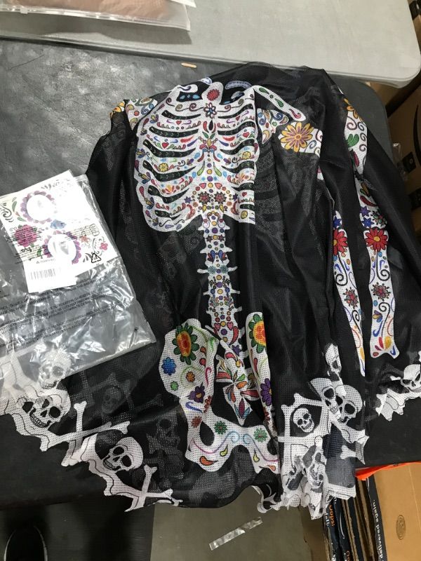 Photo 1 of Skeleton Poncho With Tattoos 