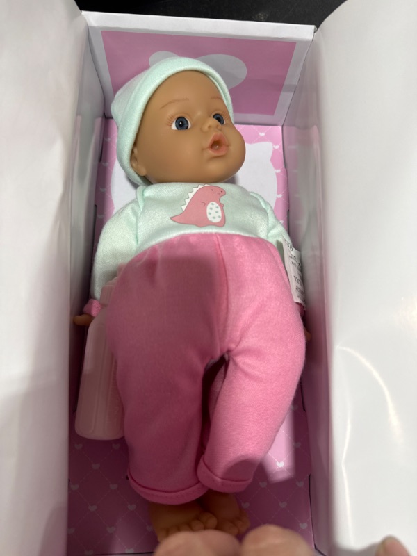 Photo 1 of ADORA Soft & Cuddly Sweet Baby Girl Dino, Amazon Exclusive 11” Adorable Baby Girl Doll with Bright Brown Eyes and Brown Painted Hair, Includes Baby Doll Bottle, Jersey Knit Top and Pants Green/Pink