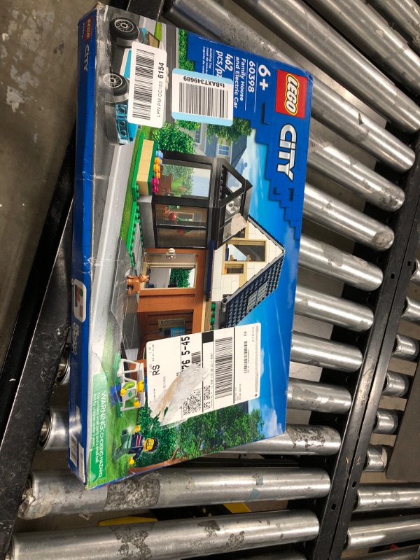 Photo 1 of LEGO My City Family House and Electric Car 60398 Building Toy Set, Includes a Kitchen, 2 Bedrooms, Greenhouse, Solar Panels Plus 3 Minifigures and a Puppy, Gift Idea for Ages 6+