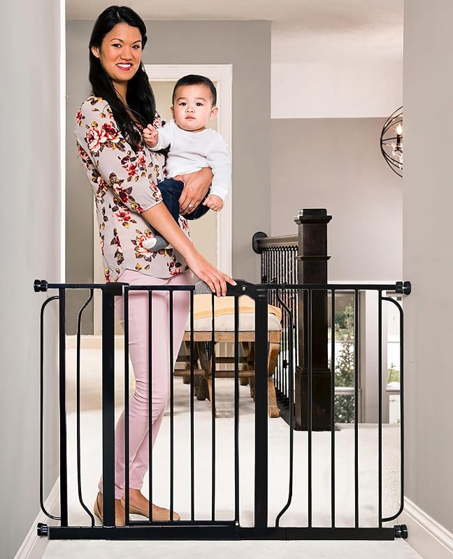 Photo 1 of Regalo Easy Step 49-Inch Extra Wide Baby Gate, Includes 4-Inch and 12-Inch Extension Kit, 4 Pack of Pressure Mount Kit and 4 Pack of Wall Mount Kit, Black
