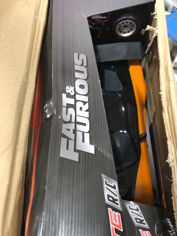 Photo 2 of Jada Toys Fast & Furious Han’s Mazda RX-7 Drift RC Car, 1: 10 Scale 2.4Ghz Remote Control Orange & Black, Ready to Run, USB Charging (Standard) (99700)