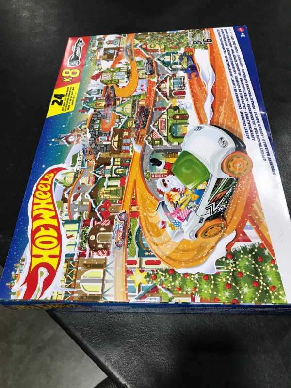 Photo 2 of Hot Wheels Toy Car Set, 2023 Advent Calendar with 8 Cars in 1:64 Scale, 16 Accessories & Playmat, Gift for Kids