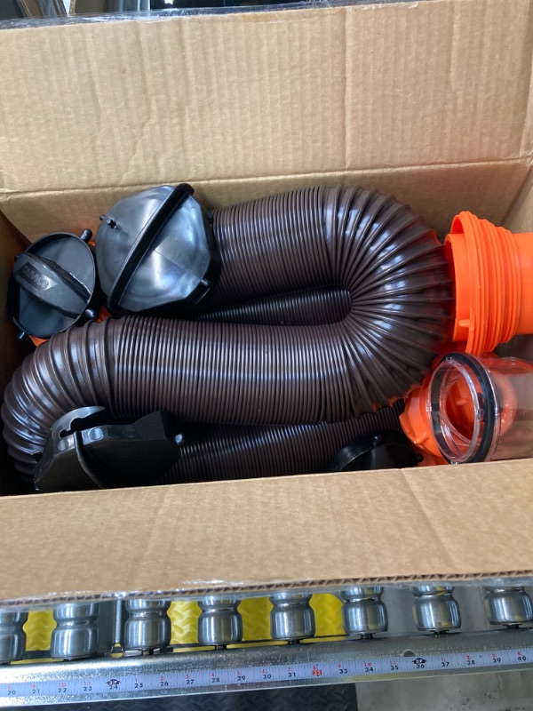Photo 1 of Camco 20' (39742) RhinoFLEX 20-Foot RV Sewer Hose Kit, Swivel Transparent Elbow with 4-in-1 Dump Station Fitting-Storage Caps Included , Black , Brown 20ft Sewer Hose Kit Frustration-Free Packaging