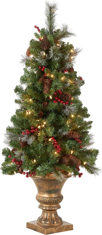 Photo 1 of ational Tree Company Pre-Lit Artificial Mini Christmas Tree, Green, Crestwood Spruce, White Lights, Decorated with Pine Cones, Berry Clusters, Frosted...