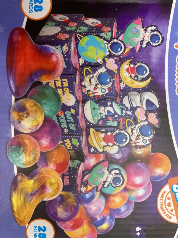 Photo 2 of BIG HOLIDAY BUNDLE: Galaxy slime, Easter eggs with gold eggs, Valentine cards and stress balls, Christmas bags, rose gold paper grass, 36 packs of stickers, yard flags, St. Patrick, coloring eastern ornaments