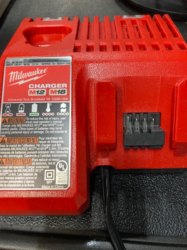 Photo 1 of Milwaukee 48-59-1808 M12 and M18 12 Volt/18 Volt Lithium-Ion Multi-Volatge Rapid Battery Charger (Non-Retail Packaging) https://a.co/d/bkQR1MW