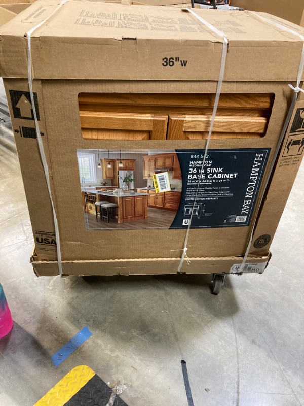 Photo 1 of Hampton Bay Hampton 36 in. W x 24 in. D x 34.5 in. H Assembled Sink Base Kitchen Cabinet in Medium Oak