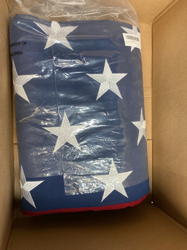 Photo 2 of American Flag 8x12 Ft TearProof Series for Outside, Made in USA, Longest Lasting, Super Tough Fade Resistant Spun Polyester, High Wind US Outdoor Flags Embroidered Stars, Sewn Stripes, Brass Grommets 8X12FT