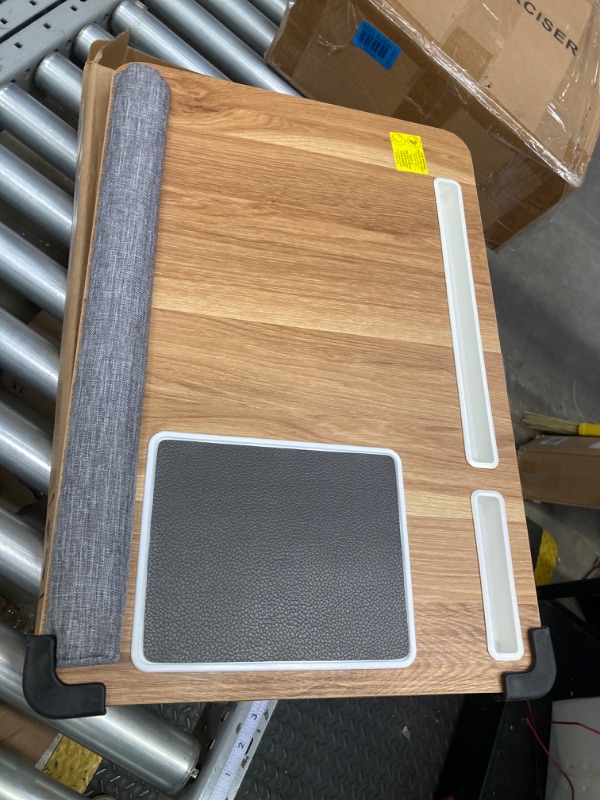 Photo 1 of HUANUO Lap Desk - Fits up to 17 inches Laptop Desk, Built in Mouse Pad & Wrist Pad for Notebook, Laptop, Tablet, Laptop Stand with Tablet, Pen & Phone Holder (Wood Grain) Light Brown Woodgrain