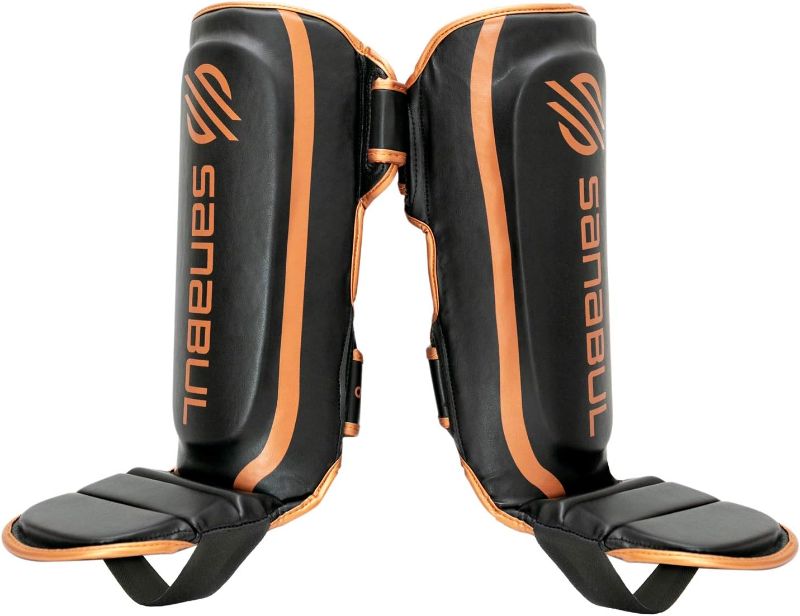 Photo 1 of Sanabul Essential Kickboxing Shin Guards with Hook & Loop Straps | Pro-Tested & Versatile Shin Pads for MMA, Muay Thai, and Kickboxing - Tailored for Comfort and Mobility, Small, Metallic Copper