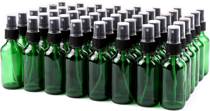 Photo 1 of 2oz Green Glass Spray Bottle, Fine Mist Boston Glass Bottles with Black Fine Mist Sprayer Small Clear Bottles for Essential Oils, Bath, Beauty, Hair & Cleaning, Amber, Pack of 48