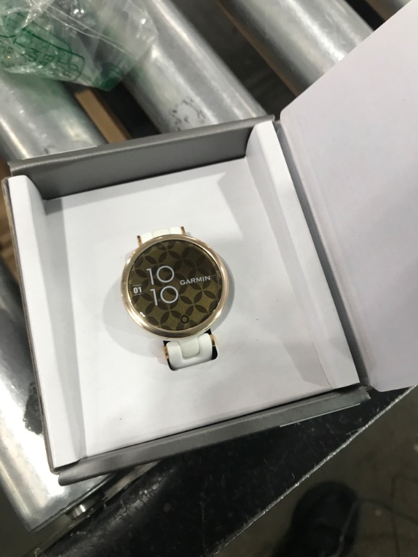 Photo 2 of Garmin Lily, Small Smartwatch with Touchscreen and Patterned Lens, Light Gold and White Light Gold and White Sport Smartwatch
